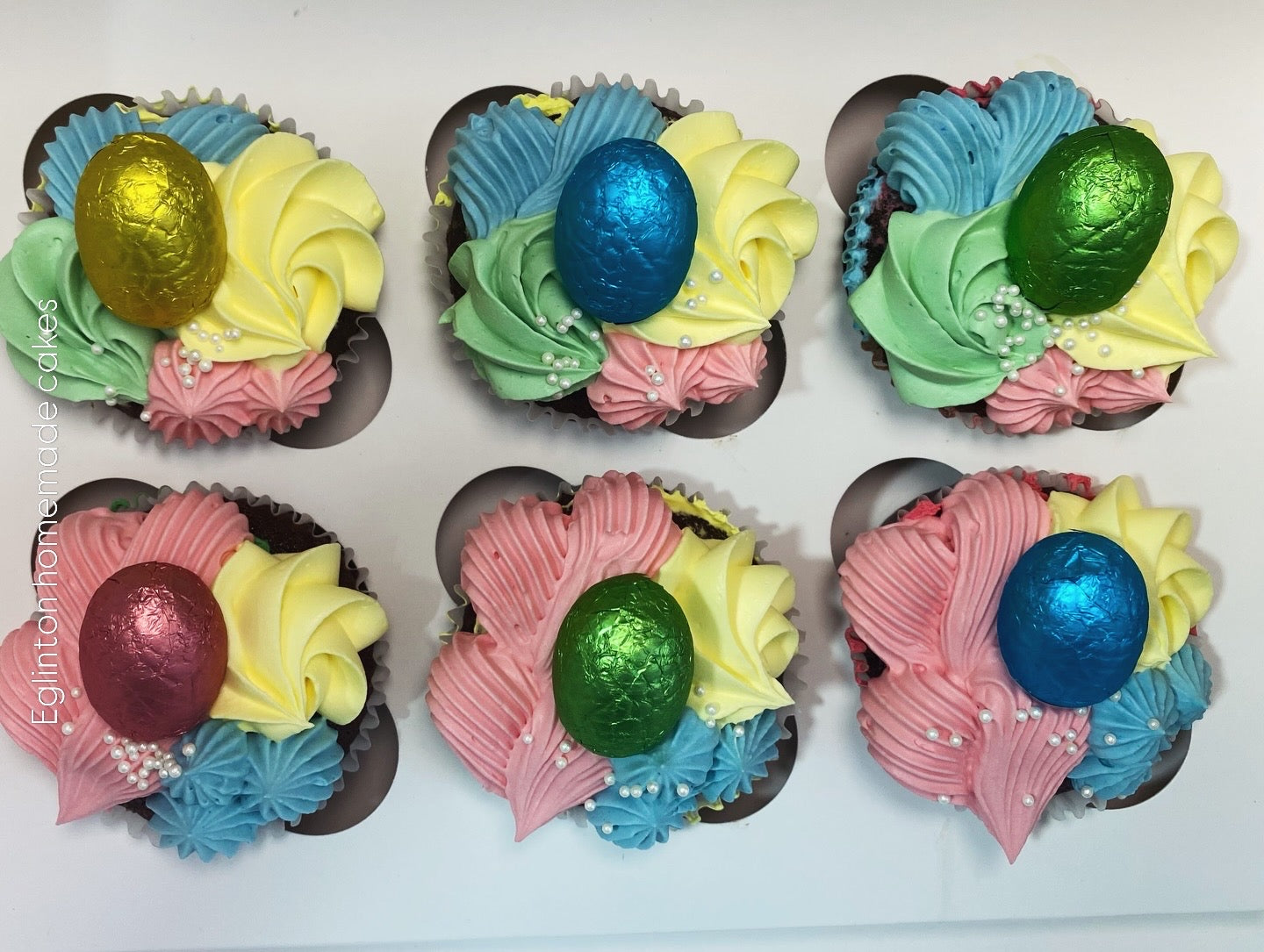easter cupcakes, pink, blue.  yellow and green